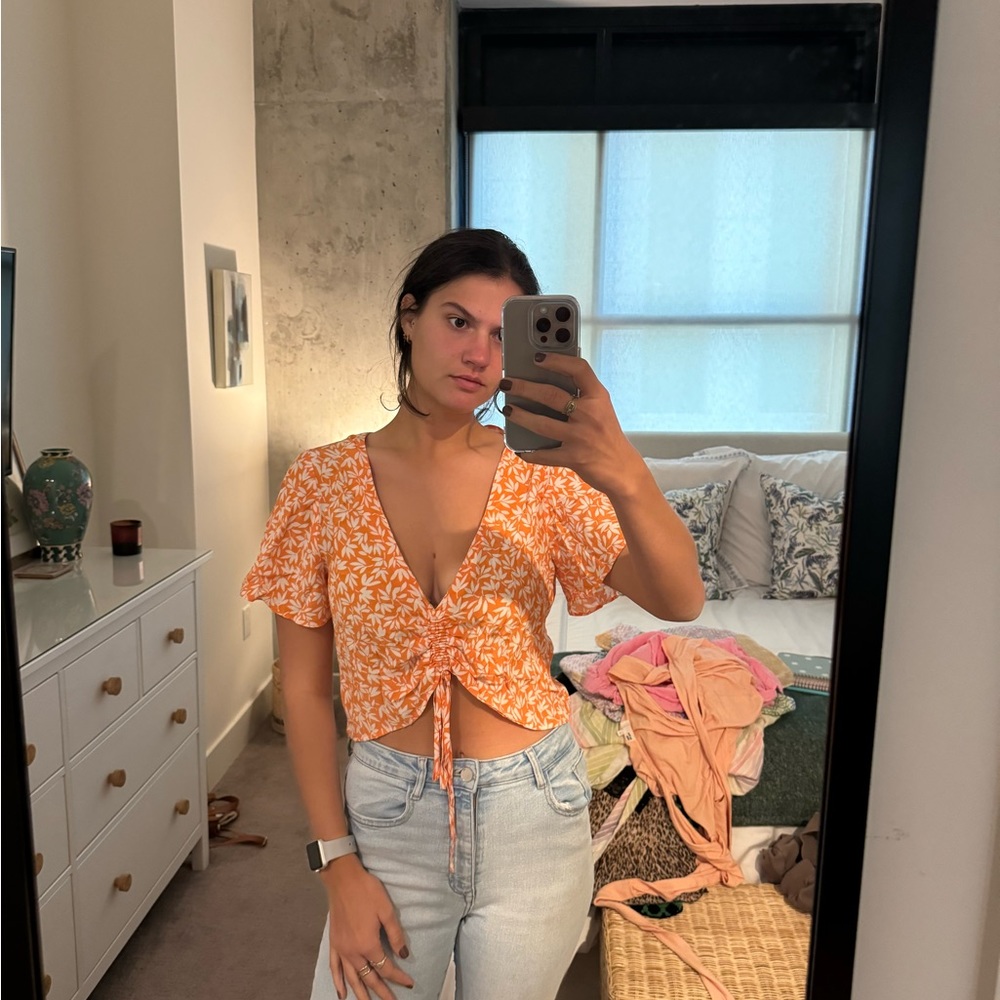 Orange crop top with flowers